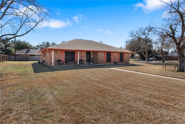 view of front of property with a yard