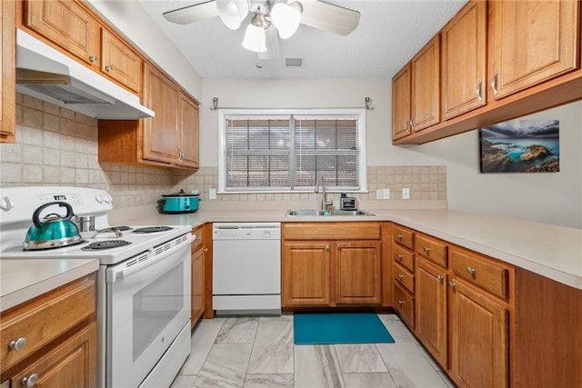 kitchen with tasteful backsplash, white appliances, ceiling fan, and sink