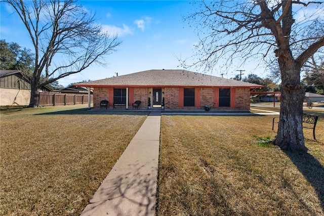 back of house with a lawn