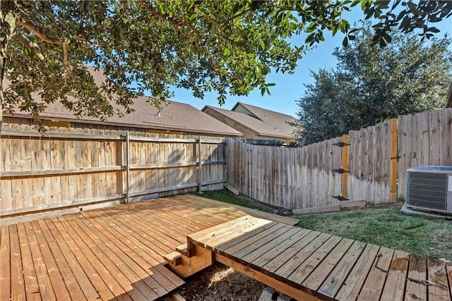 wooden deck featuring cooling unit