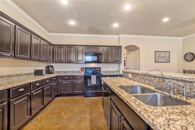 kitchen featuring sink, dark brown cabinetry, crown molding, and black appliances