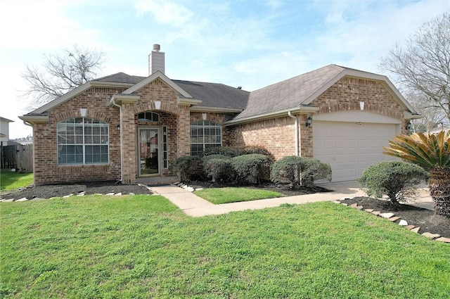 ranch-style house with a garage and a front lawn