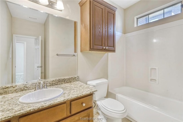 full bathroom featuring vanity,  shower combination, and toilet