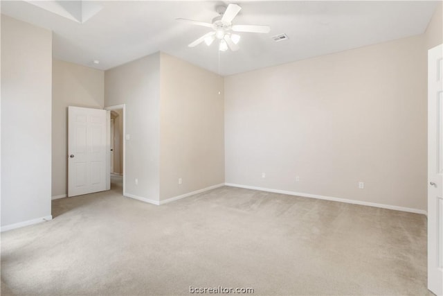 carpeted empty room featuring ceiling fan