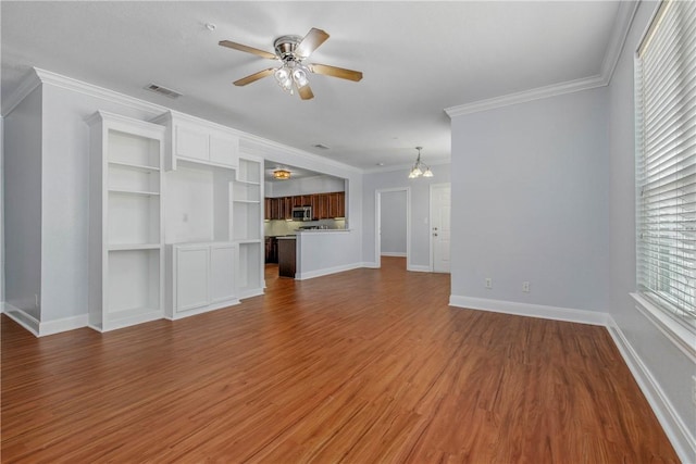 801 Luther St W Unit 106, College Station, TX 77840 - unfurnished living room featuring ceiling fan, wood finished floors, and ornamental molding