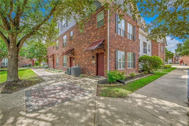 801 Luther St W Unit 106, College Station, TX 77840 - view of front of house featuring brick siding and a residential view