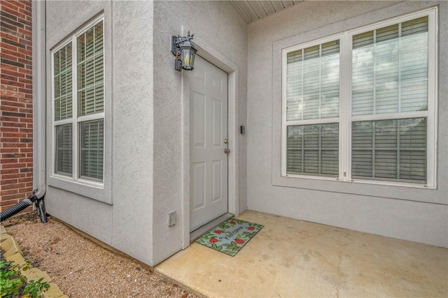801 Luther St W Unit 106, College Station, TX 77840 - view of exterior entry with stucco siding and brick siding