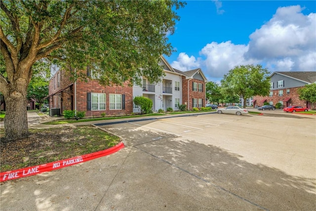 801 Luther St W Unit 106, College Station, TX 77840 - multi unit property with brick siding, uncovered parking, and a residential view