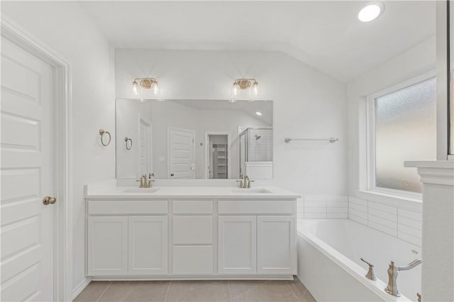 3702 Archer Falls Ct, College Station, TX 77845 - bathroom with a garden tub, double vanity, a stall shower, vaulted ceiling, and tile patterned floors
