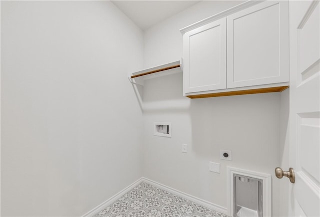 laundry area featuring electric dryer hookup, hookup for a washing machine, and cabinets