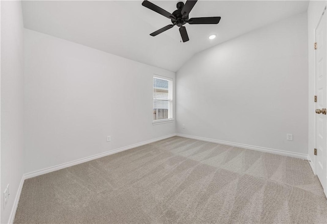 unfurnished room featuring light carpet, ceiling fan, and lofted ceiling