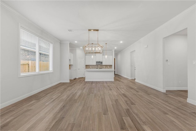 3702 Archer Falls Ct, College Station, TX 77845 - unfurnished living room with light wood-style floors, ornamental molding, and recessed lighting