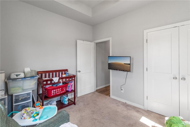 carpeted bedroom with a closet