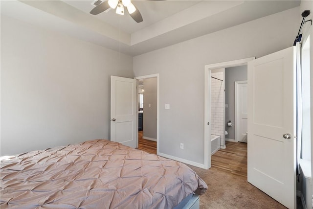 bedroom featuring light carpet and ceiling fan