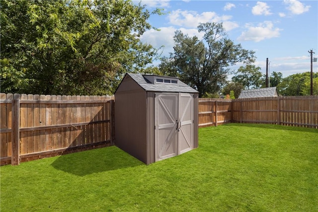 view of outbuilding with a yard