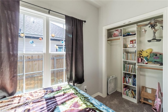 carpeted bedroom with a closet