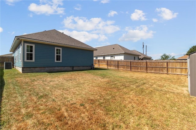 exterior space featuring a yard and central AC unit