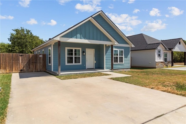 view of front of house with a front lawn and a porch