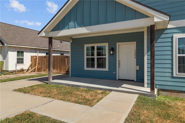 property entrance with covered porch