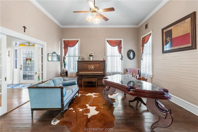 interior space with dark hardwood / wood-style flooring, ceiling fan, and ornamental molding