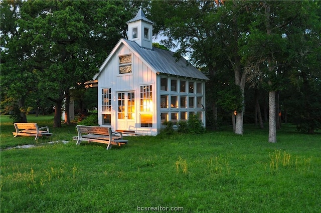 view of outbuilding with a lawn