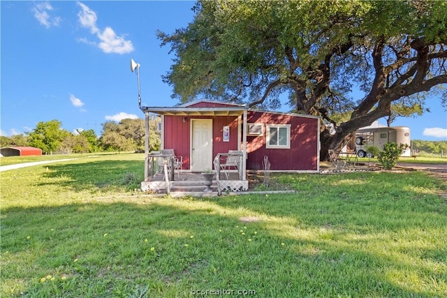 view of outdoor structure with a lawn