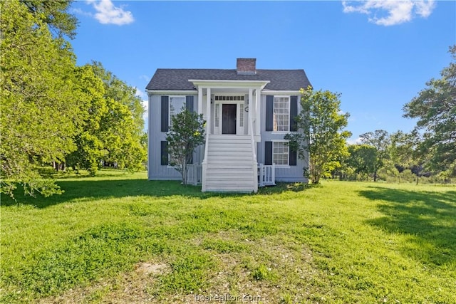 view of outdoor structure with a lawn and central AC