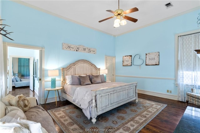 bedroom with ceiling fan, dark hardwood / wood-style floors, and ornamental molding