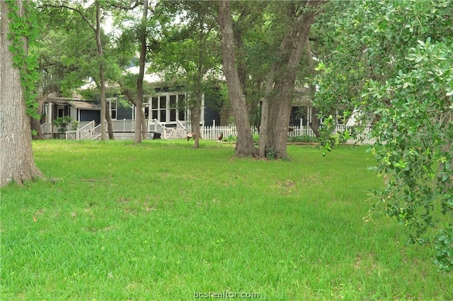 view of yard with covered porch