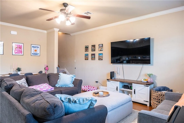 living room with ceiling fan, crown molding, and hardwood / wood-style flooring