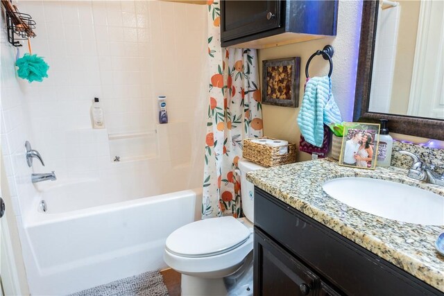 full bathroom with vanity, toilet, and shower / bathtub combination with curtain