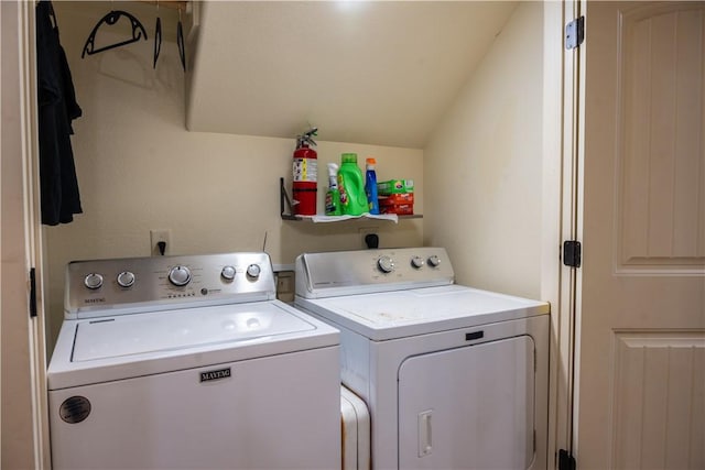 laundry area with washing machine and clothes dryer