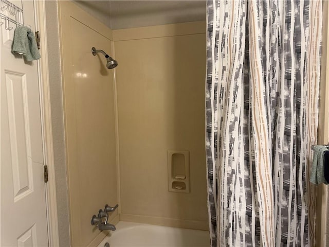 bathroom featuring shower / bathtub combination with curtain