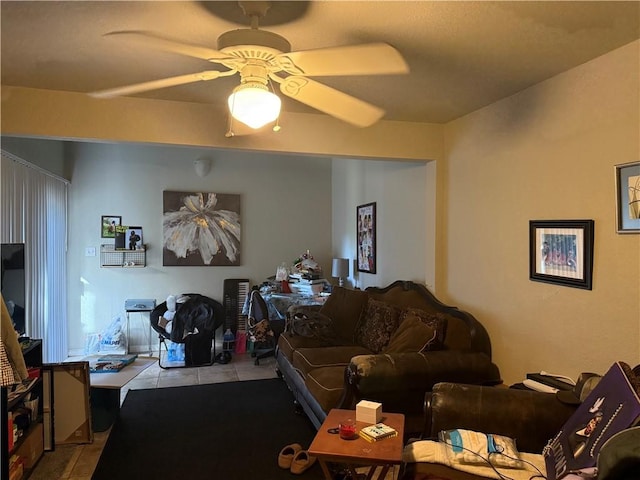 living room with ceiling fan and light tile patterned flooring