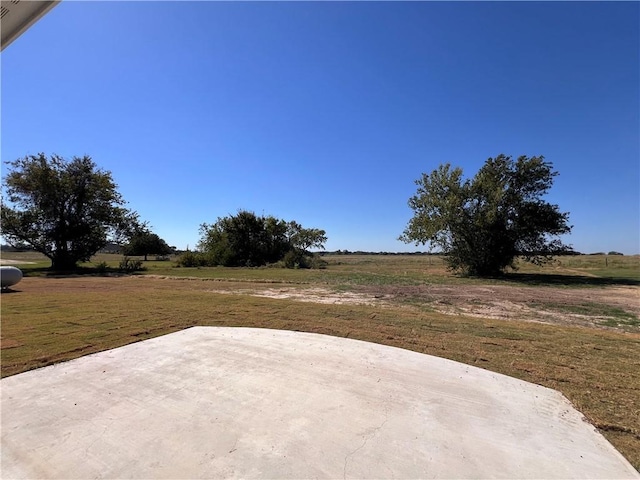 view of patio with a rural view