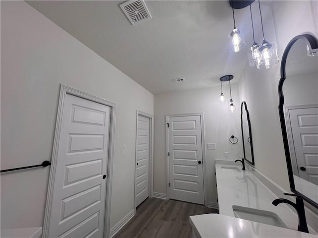 bathroom featuring vanity and hardwood / wood-style flooring