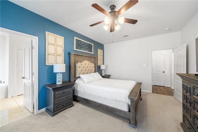 bedroom featuring ceiling fan and light colored carpet