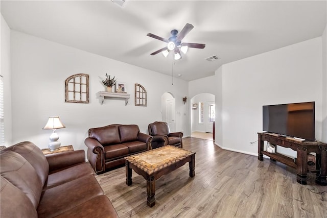 living room with ceiling fan and wood-type flooring