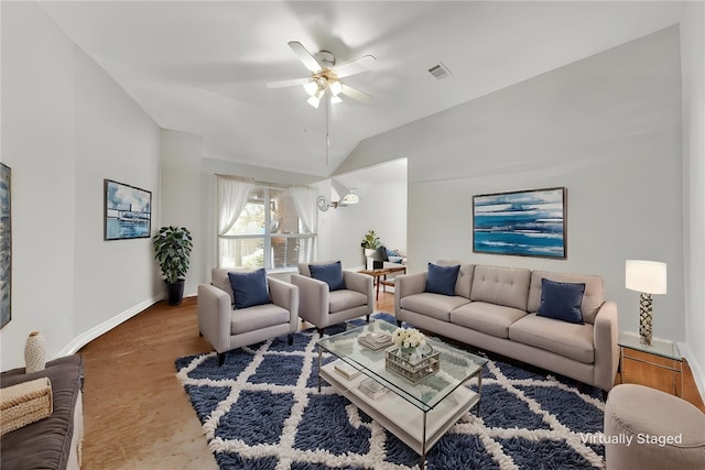 living room with visible vents, lofted ceiling, baseboards, and ceiling fan