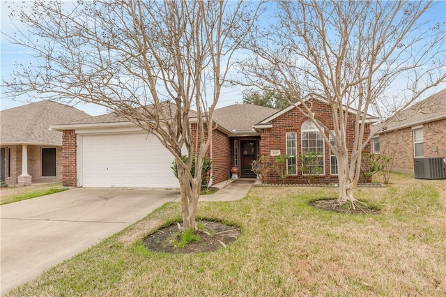 single story home featuring concrete driveway, a front yard, a shingled roof, a garage, and brick siding