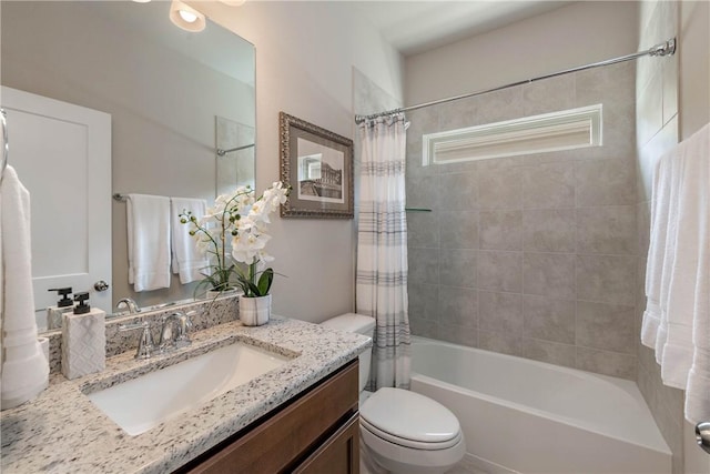 bathroom featuring shower / bath combo, vanity, and toilet