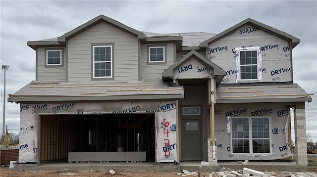 property in mid-construction with a garage