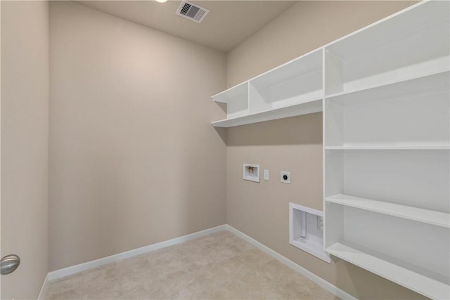 laundry room featuring hookup for an electric dryer, laundry area, washer hookup, visible vents, and baseboards