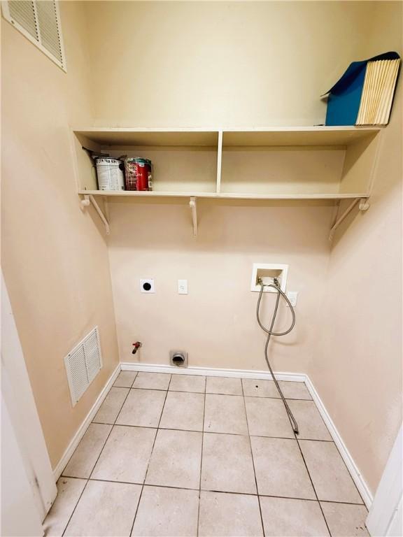 washroom with laundry area, visible vents, gas dryer hookup, washer hookup, and electric dryer hookup