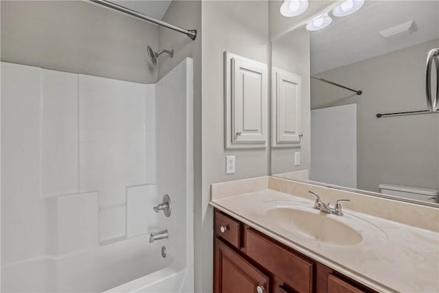 full bathroom with shower / bath combination, toilet, visible vents, and vanity