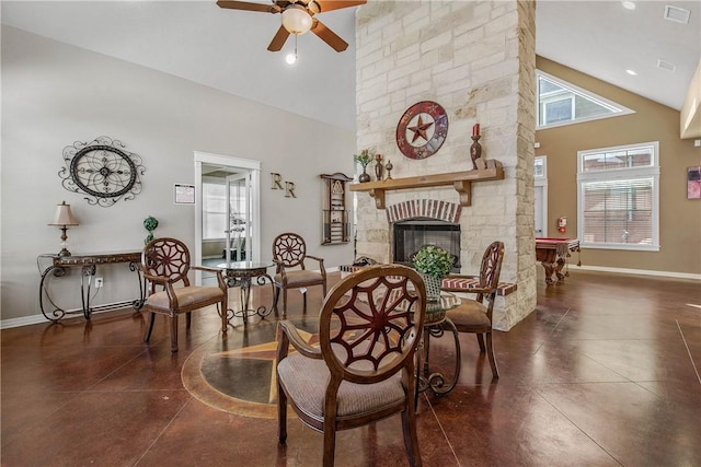 living area with visible vents, ceiling fan, baseboards, a fireplace, and high vaulted ceiling