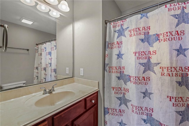 bathroom featuring vanity and a shower with curtain