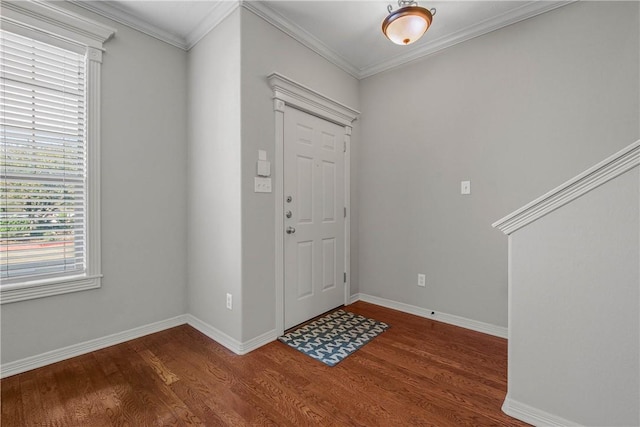 entryway featuring crown molding, baseboards, and wood finished floors