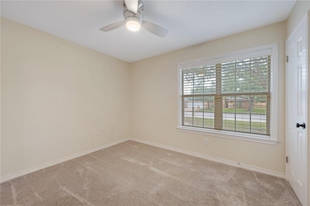 unfurnished room with light carpet, ceiling fan, and a healthy amount of sunlight