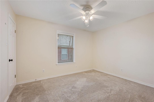 unfurnished room with light carpet and ceiling fan